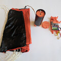 Unpacked drone parachute and launcher canister with automatic trigger system