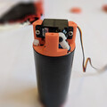 Closeup view of a drone parachute launcher after resetting the piston