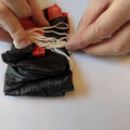 Demonstration of z-folding the shroud lines of a drone parachute