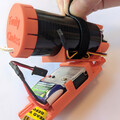 Demonstration of securing a drone parachute launcher to a mounting plate