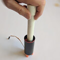 Demonstration of aligning the piston and servo arm of a drone parachute launcher