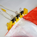 Parachute with neatly separated shroud lines secured in a parachute folding and rigging jig