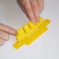 Demonstration of inserting the line separator into the base of a parachute folding and rigging jig