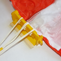 Demonstration of combing and folding the shroud lines of a parachute using a parachute folding and rigging jig