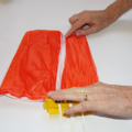 Demonstration of folding the canopy of a parachute using a parachute folding and rigging jig