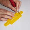 Demonstration of preparing the base of a parachute folding and rigging jig