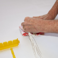 Demonstration of folding the canopy of a parachute using a parachute folding and rigging jig