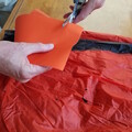 Demonstration of cutting kite tape for patching a parachute