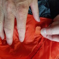 Demonstration of applying a patch to a damaged parachute canopy