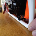 Demonstration of securing a packed drone parachute on a drone airframe