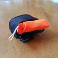 Side view of a packed drone parachute before installation on the drone