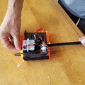 Demonstration of removing Velcro from a drone parachute flip board