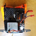 Demonstration of hooking the flip board loop over the servo arm