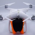 Drone with drone parachute fully packed and installed on the drone airframe