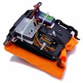Packed drone parachute on ejection flip board with Mayday trigger system installed