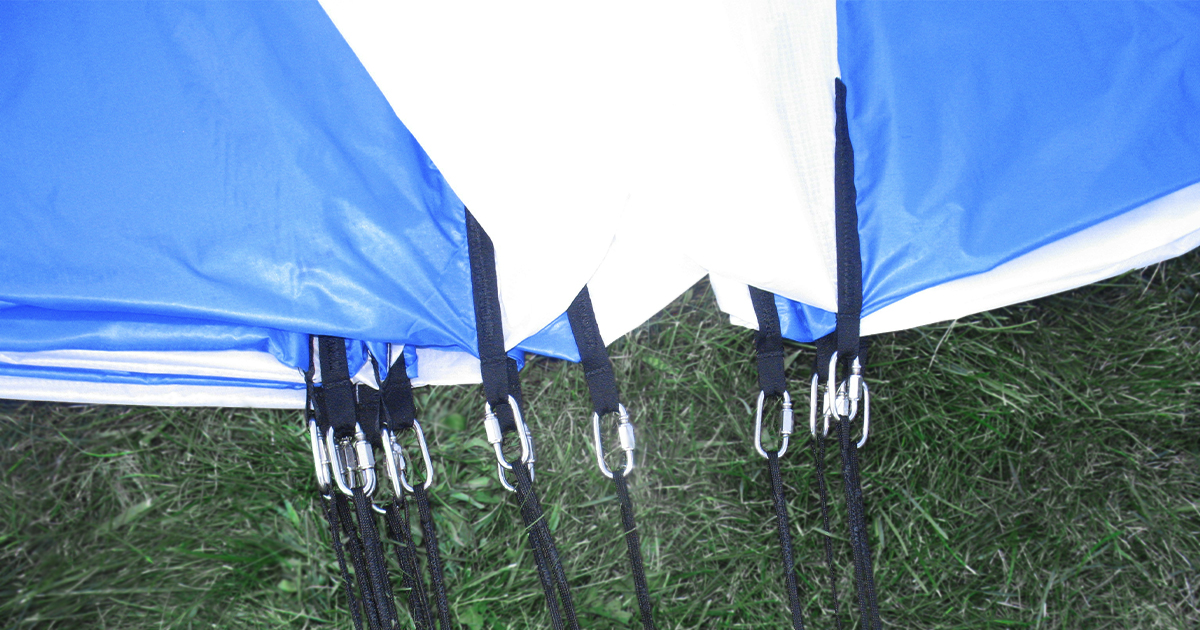 Close-up view of the parachute's skirt with load harness connections on the shroud lines