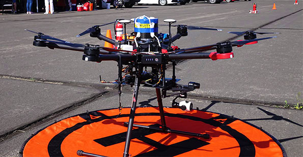 UAV on tarmac at NIAS with drone parachute ballistic recovery system installed